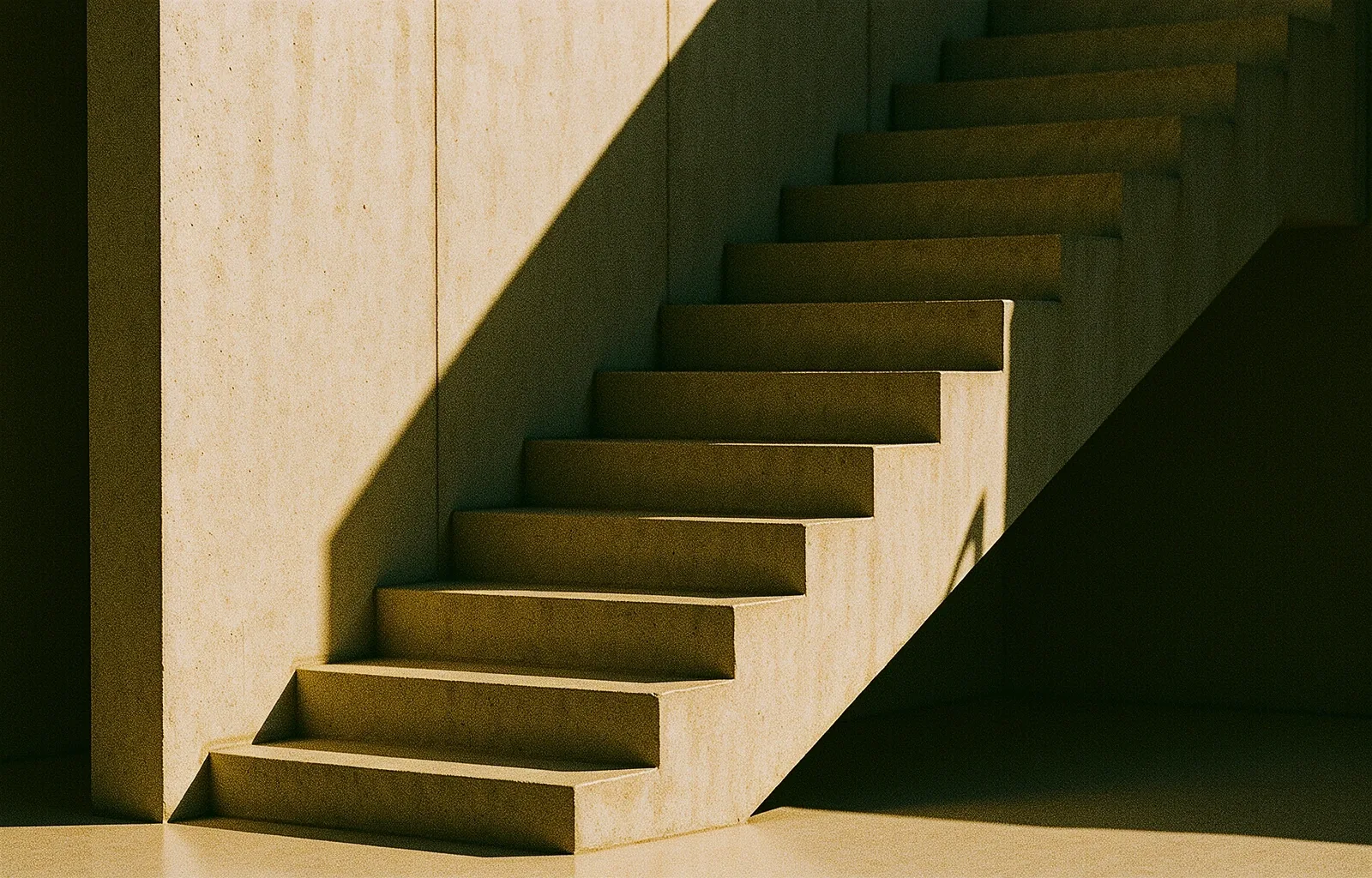 Architectural geometry of a concrete sun-drenched staircase