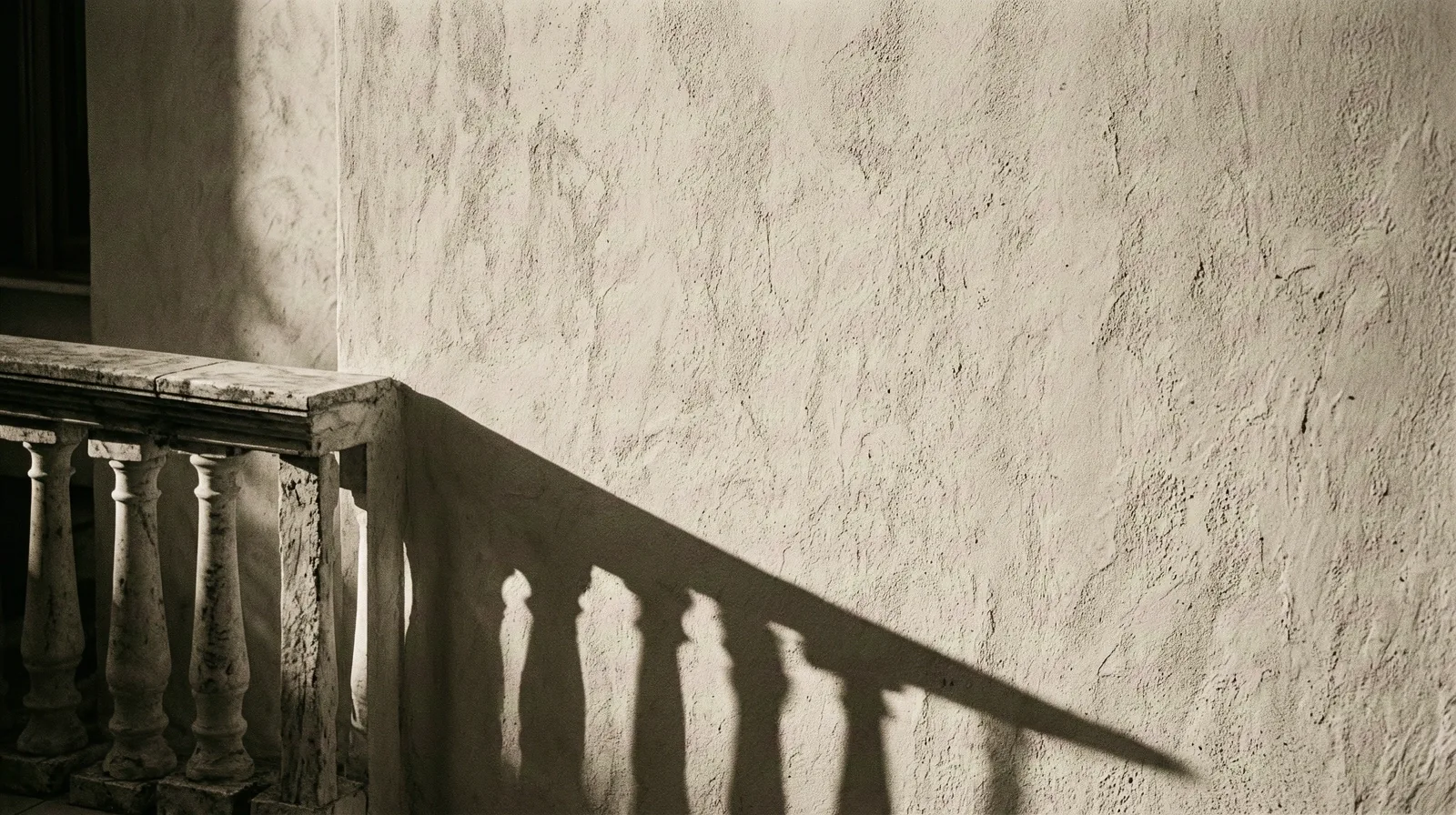 Architectural shadows on a Greek wall